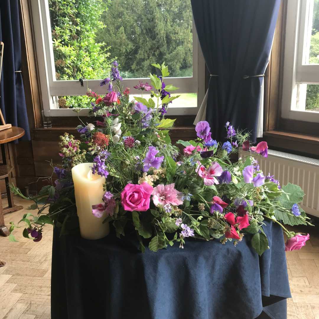 A central flower arrangement with pinks and blues.